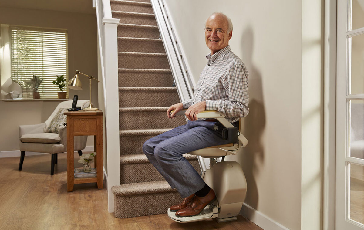 Man on Acorn stairlift installation