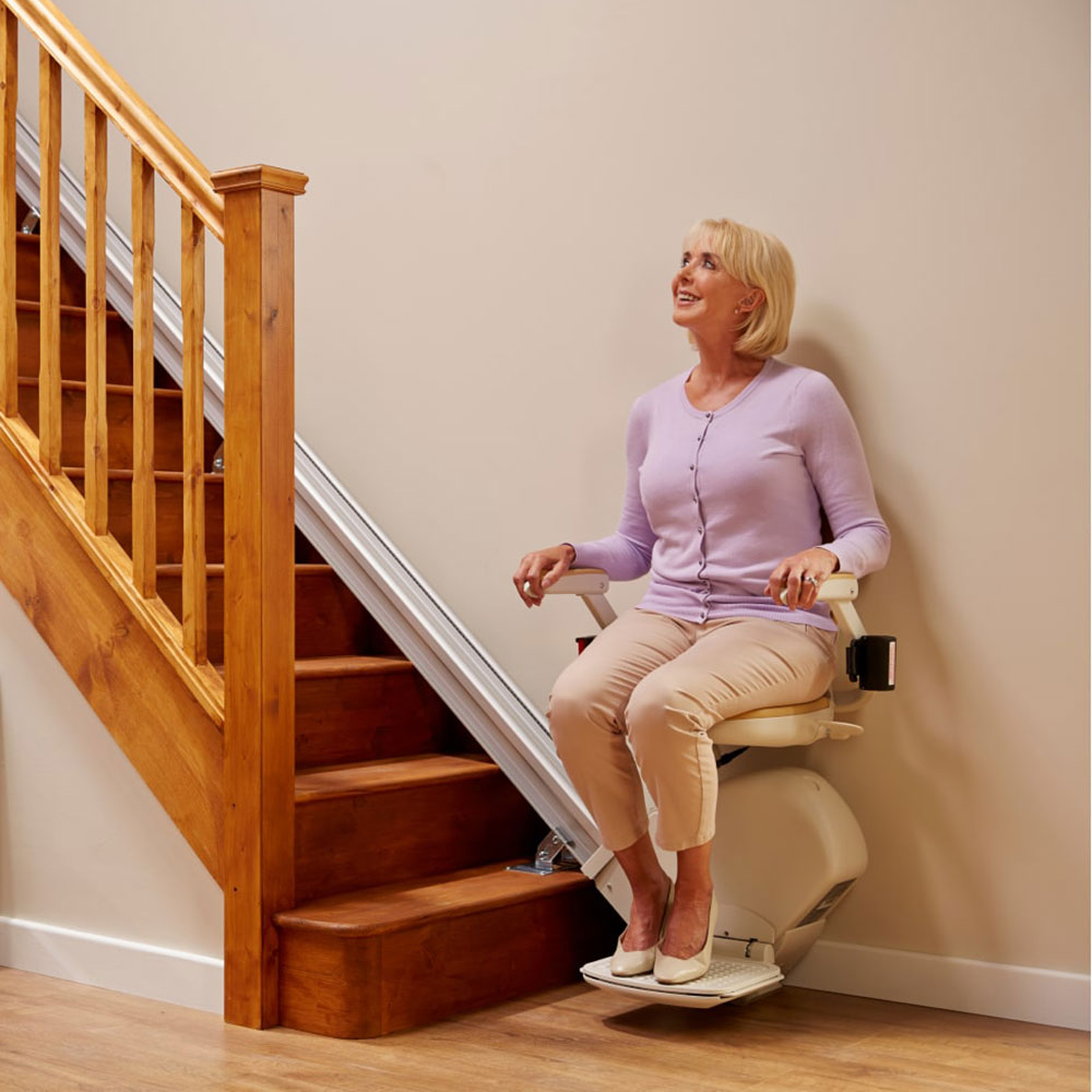 Woman on straight Acorn stairlift